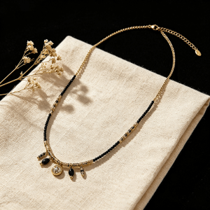 vintage mixed black bead charm necklace with round crystal pendant